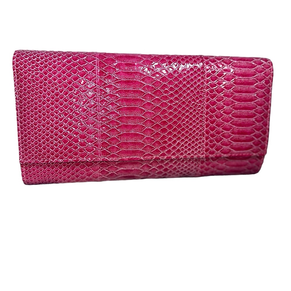 Chic pink snake-embossed clutch. Add a pop of color to your style!